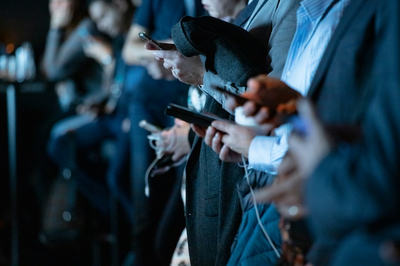 People on phones representing social media cancel culture and effects on accountability